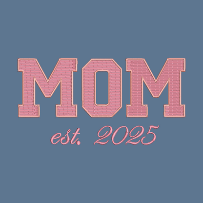 A digital graphic design featuring the word 'MOM' in large, pink varsity-style block letters with a stitched texture, outlined in a peach outline, above the script text 'est. 2025' on a solid slate blue background.