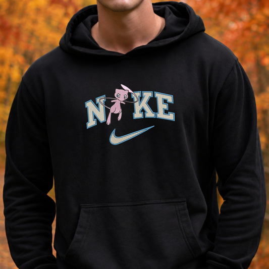 a black sweatshirt with an embroidered design of a pokemon mew character in the NIKE logo with a swoosh