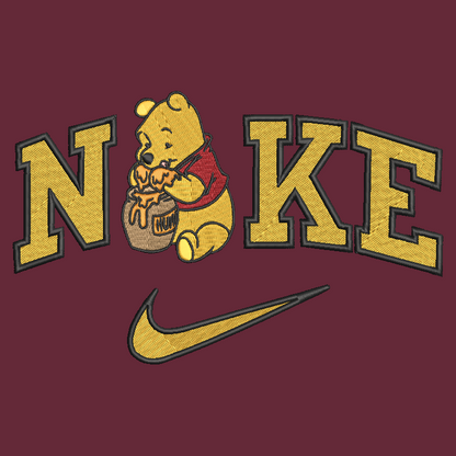 maroon background with embroidered winnie the pooh in the middle of the nike logo