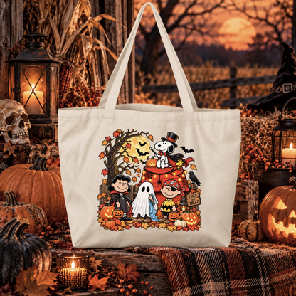 beige canvas tote bag with a graphic of the peanuts gang on halloween in costumes that says trick or treat