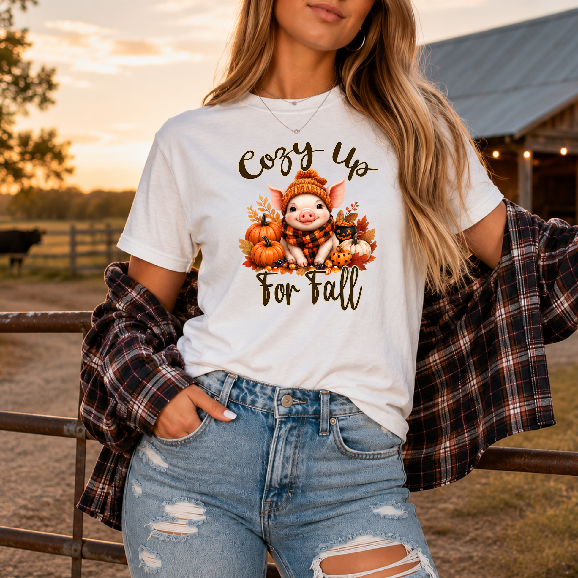 woman wearing a white tshirt with a pig in a scarf with fall pumpkins graphic that says cozy up for fall