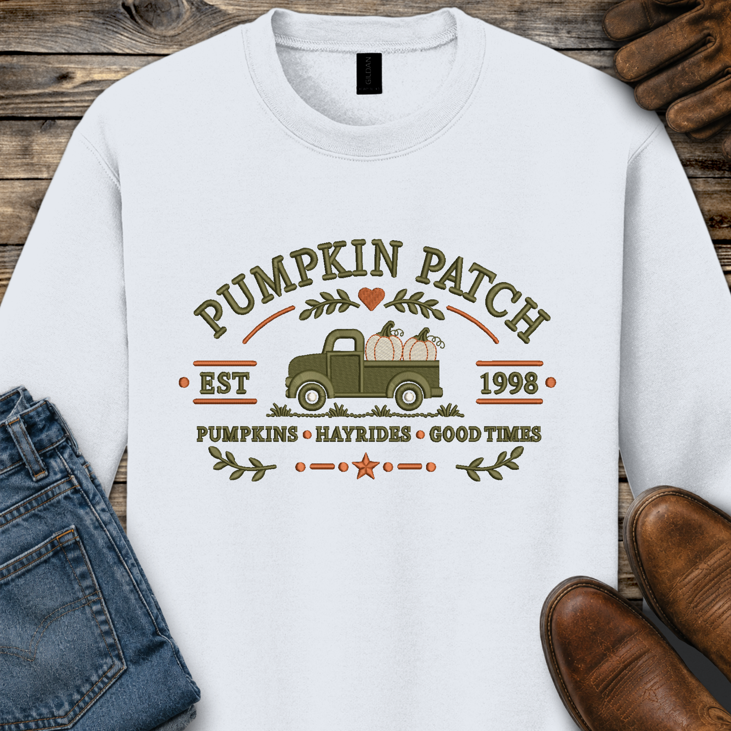 white sweatshirt with embroidered old truck and pumpkins that says pumpkin patch on it
