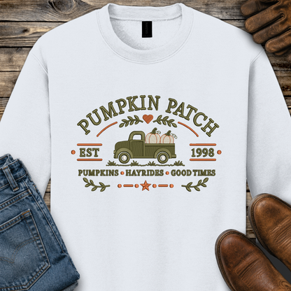 white sweatshirt with embroidered old truck and pumpkins that says pumpkin patch on it