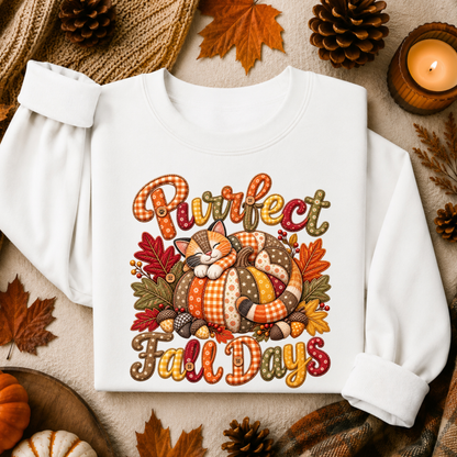 A white long-sleeve sweatshirt laid flat on a cozy autumn-themed background. The front features a colorful graphic with the words 'Purrfect Fall Days' in a decorative plaid-style font, surrounding a sleeping cat curled up inside a pumpkin.