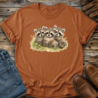 orange tshirt with a watercolor style graphic of baby raccoons
