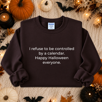 brown sweatshirt with a text graphic that says I refuse to be controlled by a calendar Happy Halloween everyone