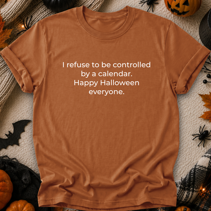 orange tshirt with a text graphic that says I refuse to be controlled by a calendar Happy Halloween everyone