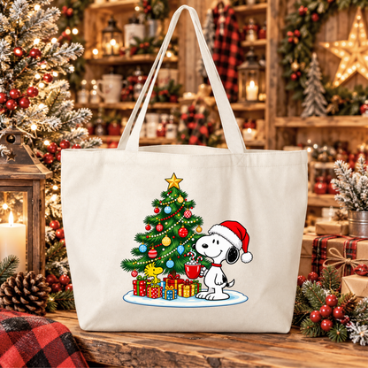 A cream canvas tote bag featuring a festive graphic of Snoopy and Woodstock by a decorated Christmas tree, set against a cozy, warmly lit holiday background.