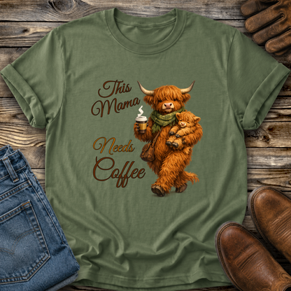 green tshirt with a highland cow holding her calf and a cup of coffee that says this mama needs coffee