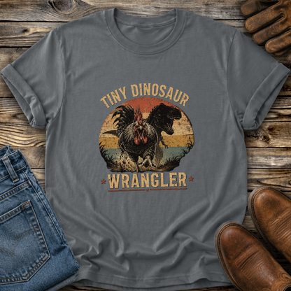 gray tshirt with a distressed graphic of a angry chicken and dinosaur that says tiny dinosaur wrangler