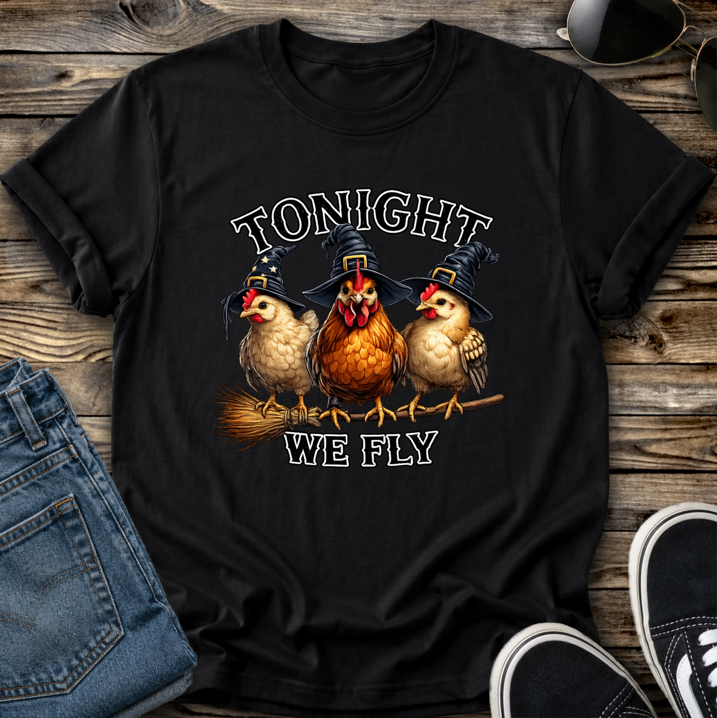 black tshirt with funny chicken witches on a broomstick graphic design that says tonight we fly