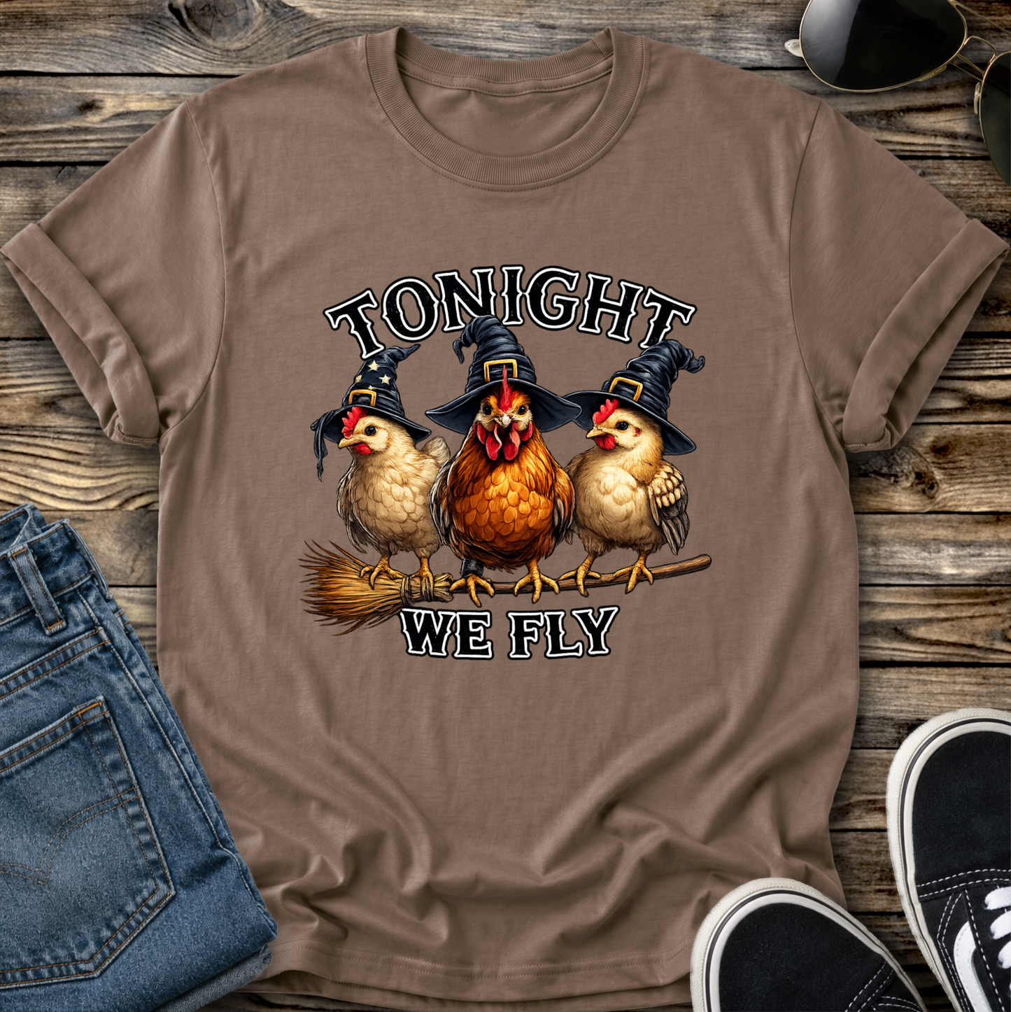 brown tshirt with funny chicken witches on a broomstick graphic design that says tonight we fly
