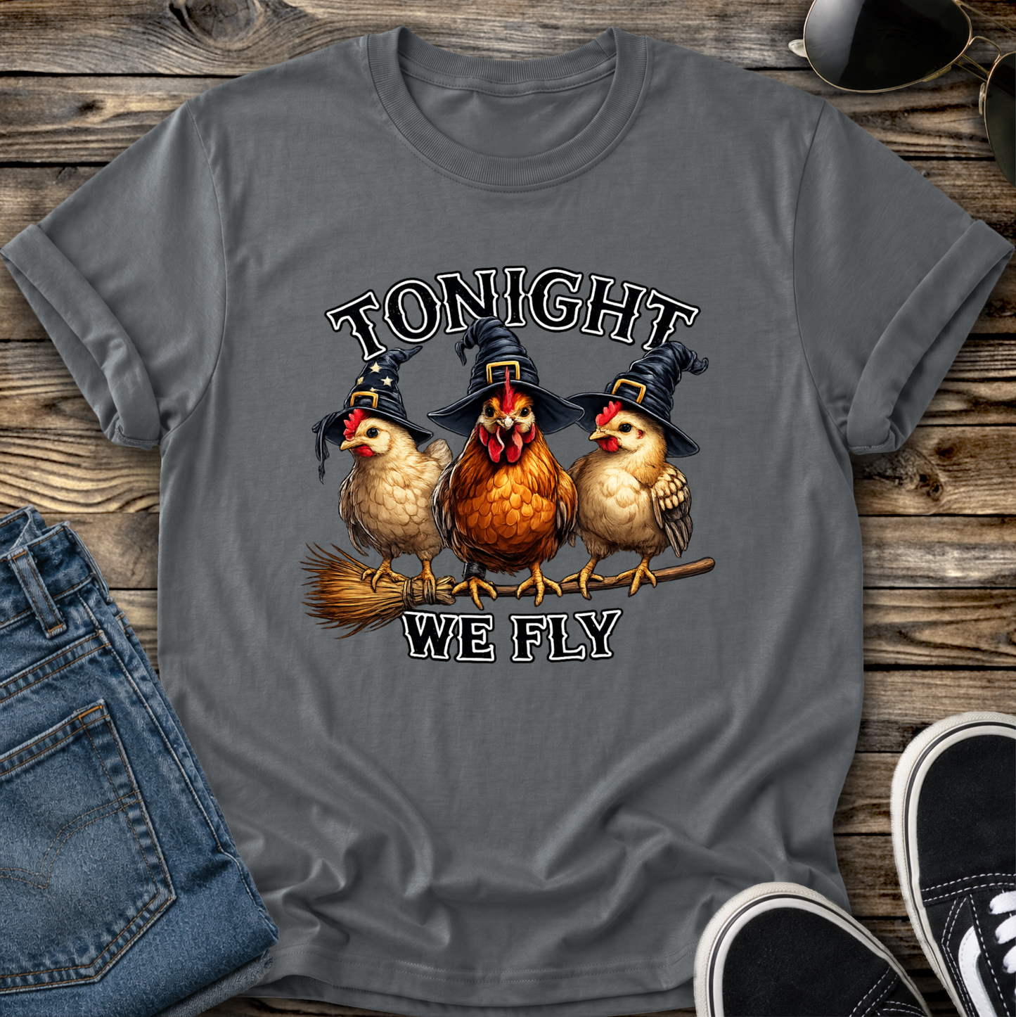 gray tshirt with funny chicken witches on a broomstick graphic design that says tonight we fly