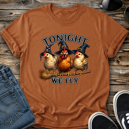orange tshirt with funny chicken witches on a broomstick graphic design that says tonight we fly