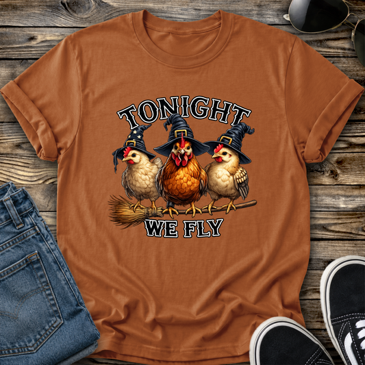 orange tshirt with funny chicken witches on a broomstick graphic design that says tonight we fly