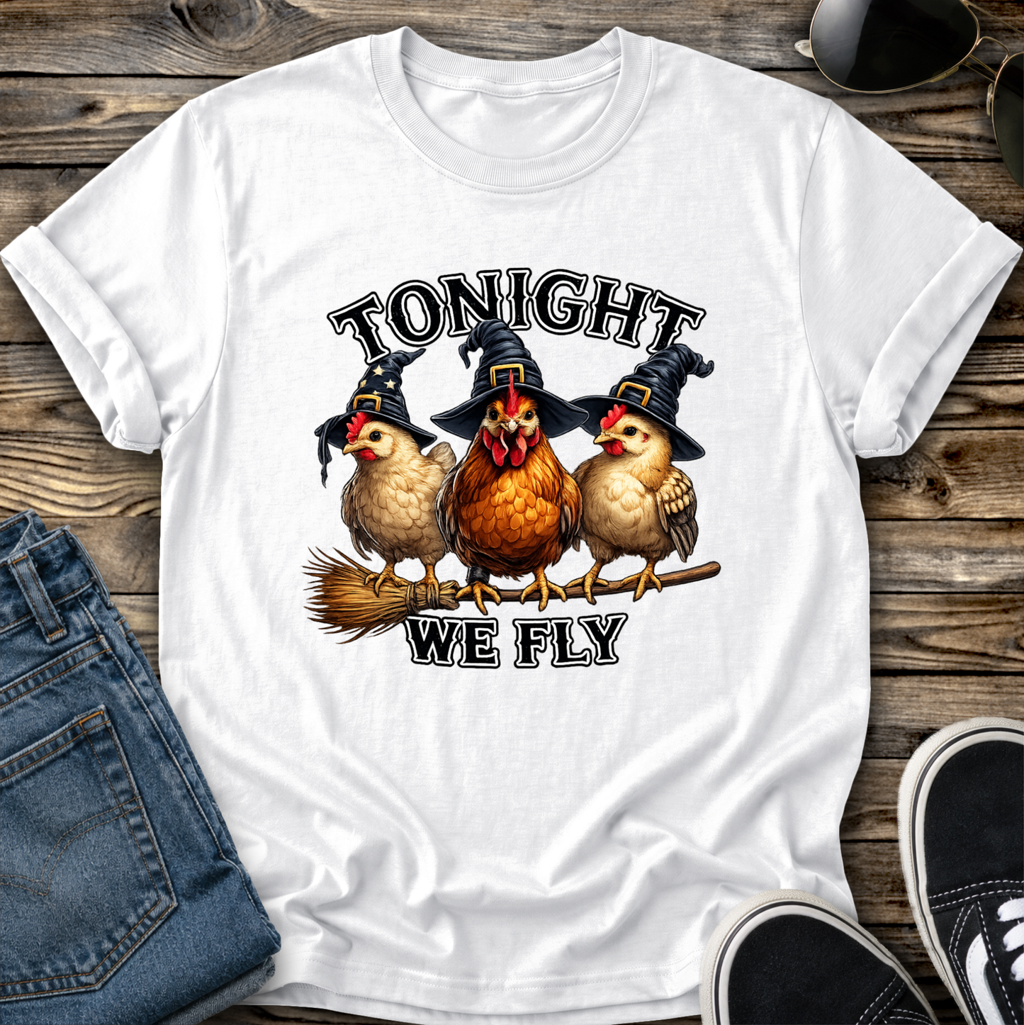white tshirt with funny chicken witches on a broomstick graphic design that says tonight we fly