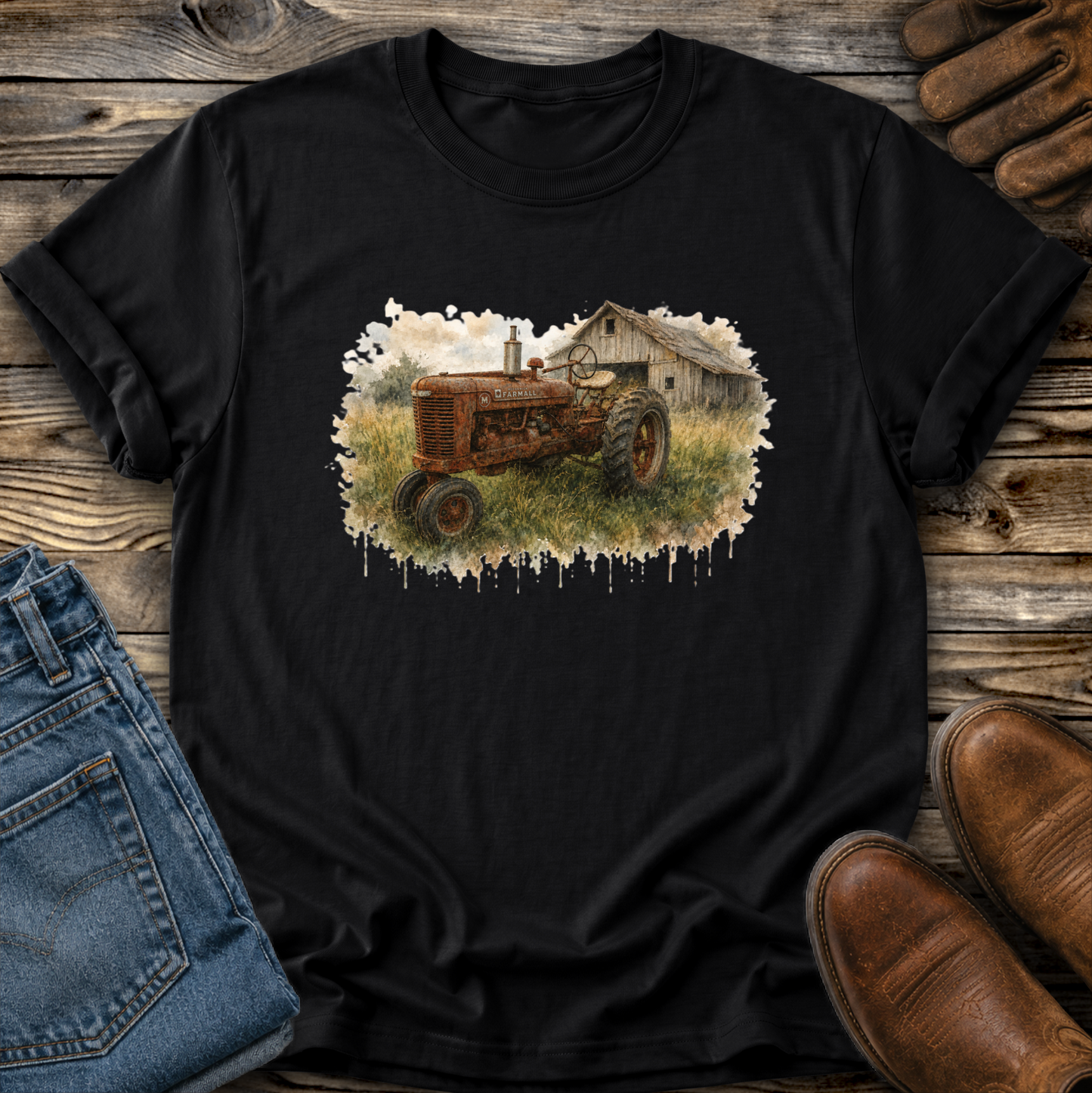 black tshirt with a watercolor barn and rusty farmall tractor farm scene graphic on it