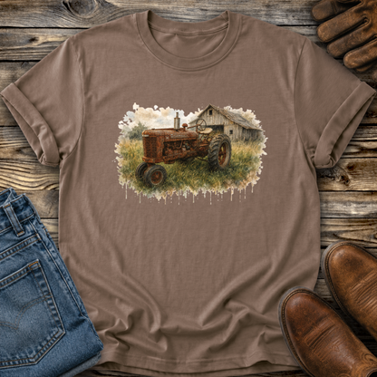 brown tshirt with a watercolor barn and rusty farmall tractor farm scene graphic on it