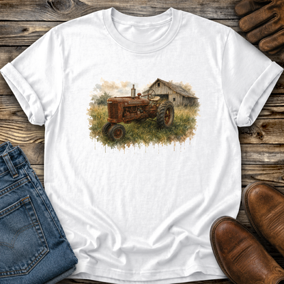 white tshirt with a watercolor barn and rusty farmall tractor farm scene graphic on it