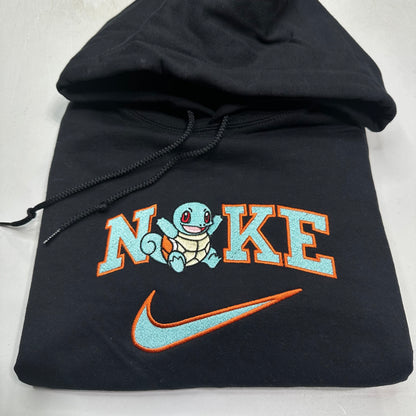 pokemon squirtle with nike logo embroidered on a black sweatshirt