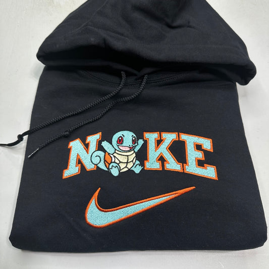 pokemon squirtle with nike logo embroidered on a black sweatshirt