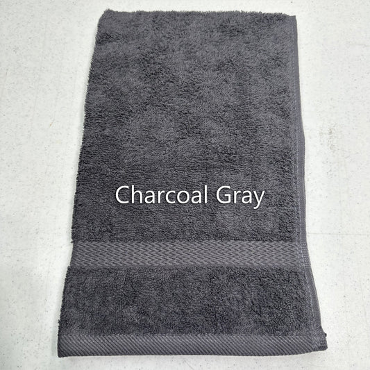Charcoal gray hand towel on a light gray background