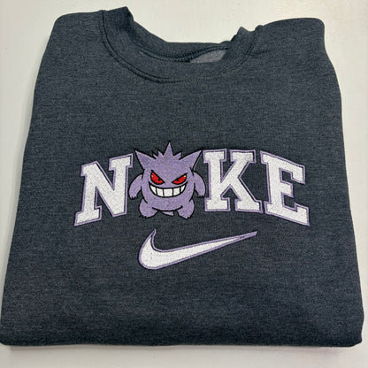 gray sweatshirt with pokemon gengar embroidered design in the nike logo on it