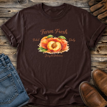 brown tshirt with peaches graphic that says farm fresh picked daily