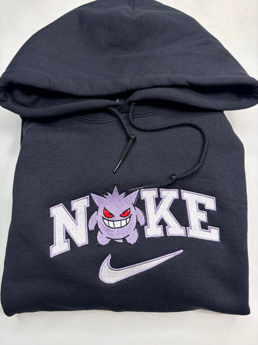 black sweatshirt with pokemon gengar embroidered design in the nike logo on it