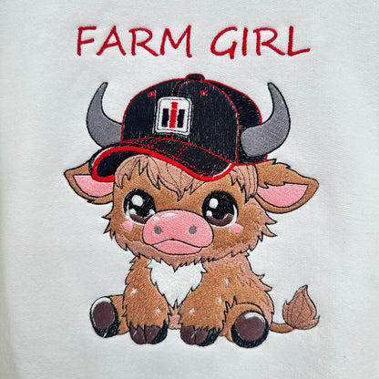 highland cow embroidered with a tractor logo on hat says farm girl