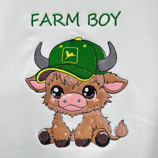 highland cow embroidered wearing a green tractor hat