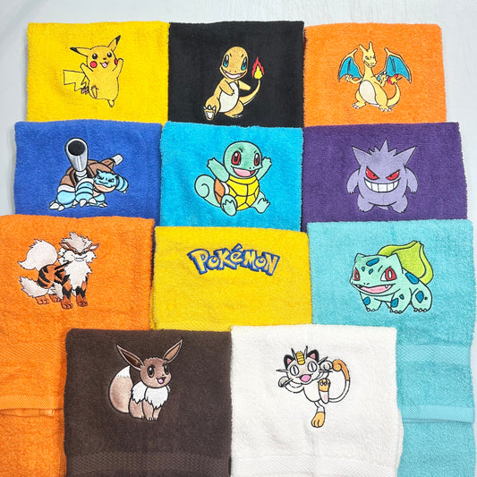 Collection of colorful towels with various Pokémon characters on a white background