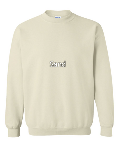 A light beige crewneck sweatshirt with the word 'Sand' printed in gray text with a white outline on the chest, displayed against a plain white background.